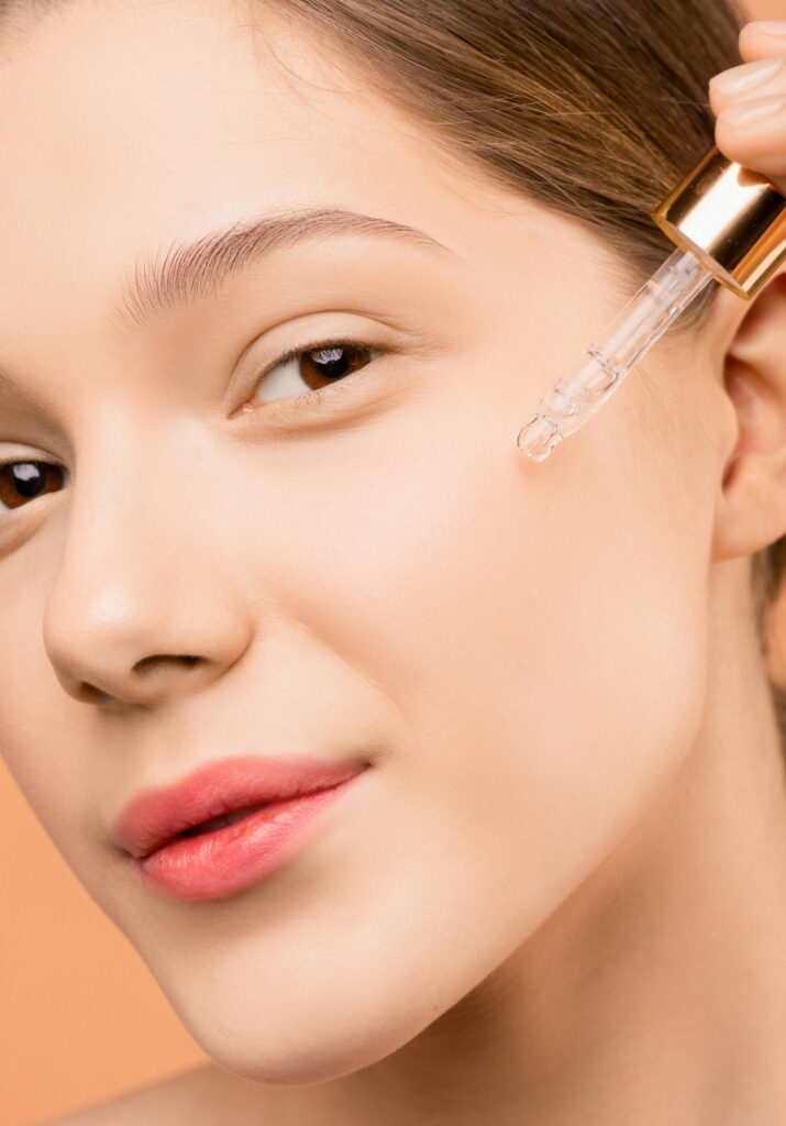 Woman applying trending collagen body serum to skin
